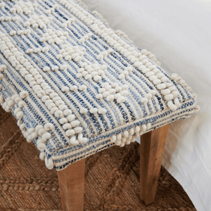 Close up of Handwoven Denim Bench with Wood Legs.