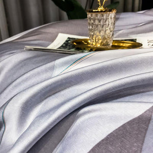 Purple diamond bedsheets close up.