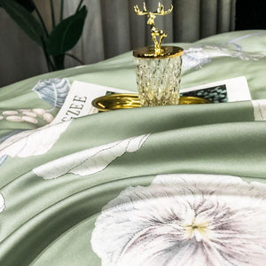 Green bedding sheets with flowers.