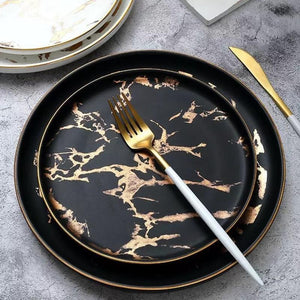 Lighting Flat Plates Nordic Collection in black color with golden finishes.