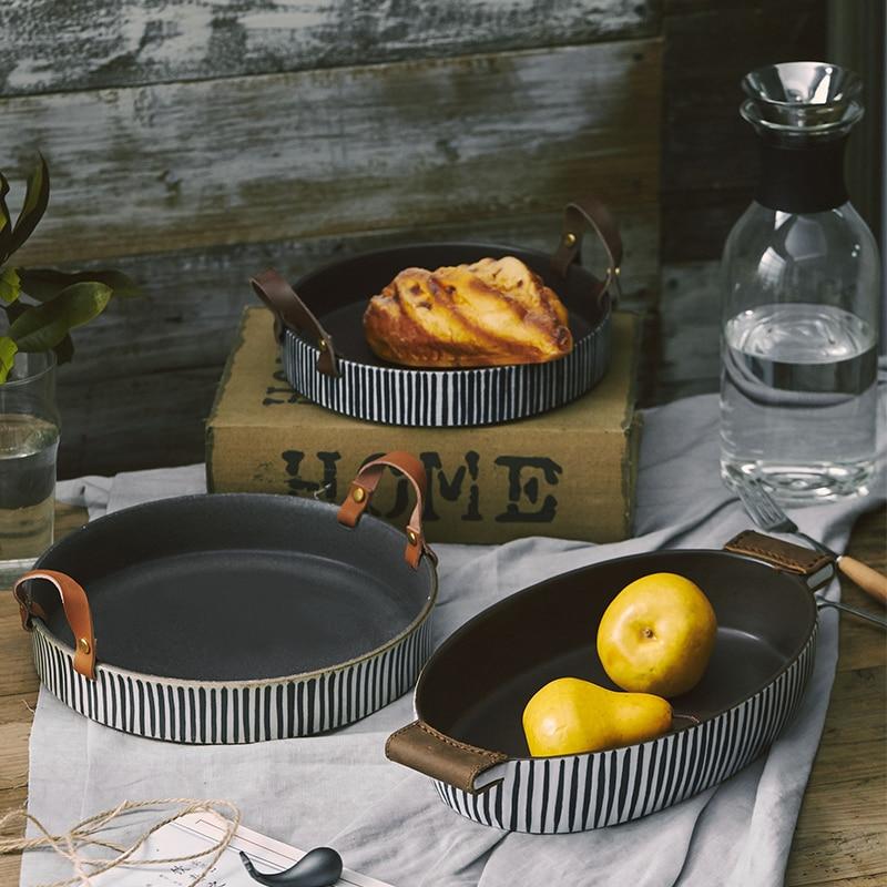 Pair of Exclusive Striped Ceramic Plates with Leather Handles.