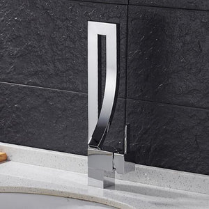 Chrome Martina Bathroom Faucet on marble sink and black background.