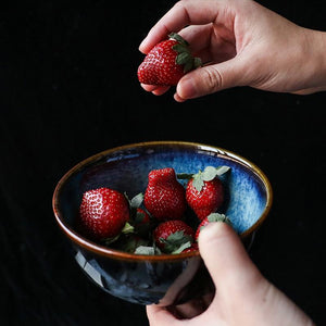 Strawberries on Glazed Blue Eye Of Cat Bowl.