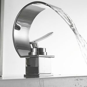Mirror bathroom faucet with curved waterfall.