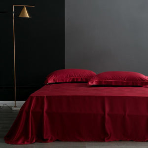 Flat bed sheets in red color.