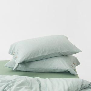 Stripe pillow covers of Olivia Duvet Cover Set in green color.