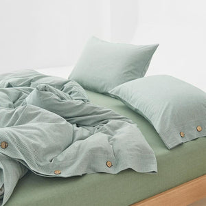 Olivia Stripe Ultra Soft Duvet Cover Set in green color with buttons.
