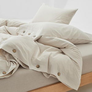 Olivia Ultra Soft Duvet Cover Set in cream color with buttons.