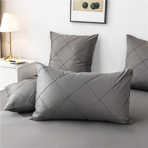 Dark gray pillow covers made of microfiber.