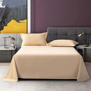 Bed wearing Juana flat bedding sheets in cream color.