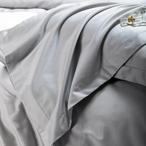 Light gray bedding sheets.