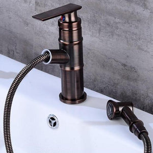 Pulled out hose of Langfoss Bathroom Faucet in brown color.