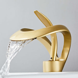 The Elegant and Modern Versailles Single-Hole, Single-Handle Luxury Waterfall Bathroom Faucet in Gold Color.