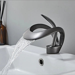 The Elegant Versailles Single-Hole, Single-Handle Luxury Waterfall Bathroom Faucet in Grey Color.