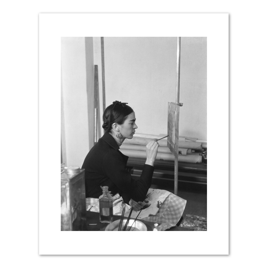 Frida painting Self-Portrait on the Borderline between Mexico and the United States by unknown photographer