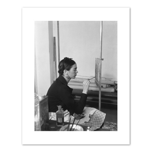 Frida painting Self-Portrait on the Borderline between Mexico and the United States by unknown photographer