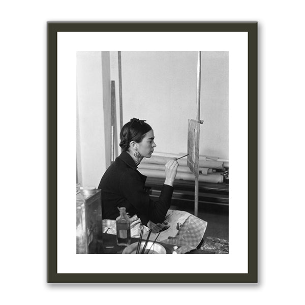 Frida painting Self-Portrait on the Borderline between Mexico and the United States by unknown photographer