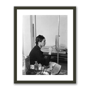 Frida painting Self-Portrait on the Borderline between Mexico and the United States by unknown photographer