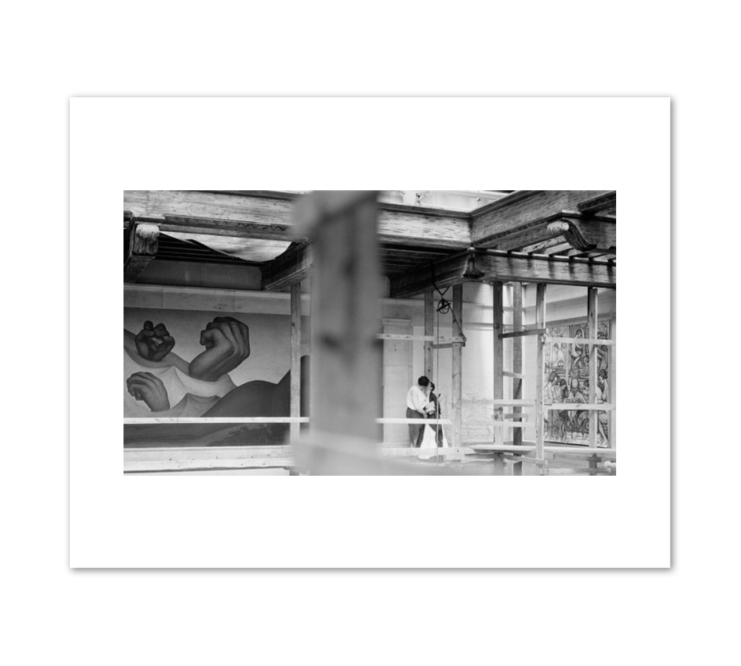 A tender moment between Rivera and Kahlo on the scaffold (Detroit Industry) by unknown photographer