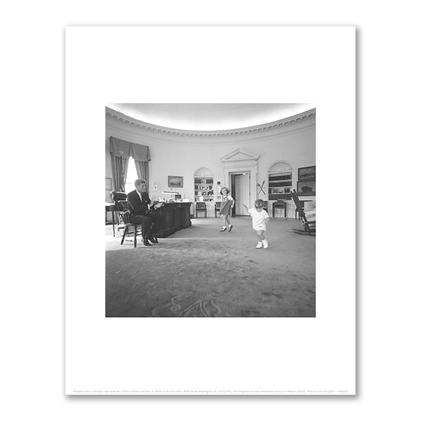 President John F. Kennedy Claps while his Children Caroline and John, Jr. Dance in the Oval Office by Cecil Stoughton