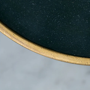 Gold colored rim. Details can be seen due to hand made plates.