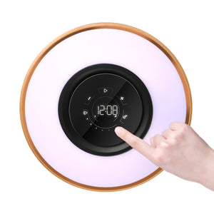 Clock demonstration of compass of life table lamp with Bluetooth speaker and wireless phone charger.