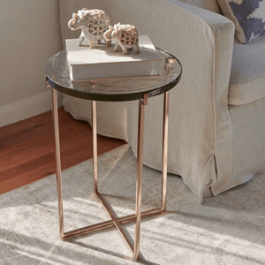 Luxe Glass Side Table With Rose Gold Metal Leg on Anaya's rug. On top Anaya's marble elpehants.