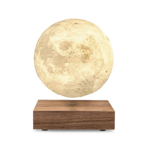 Walnut floating moon lamp with yellow light.