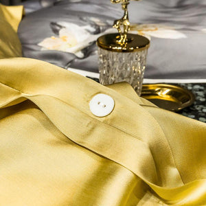 White button used in Front view of Orquidea Clara Duvet Cover Set.