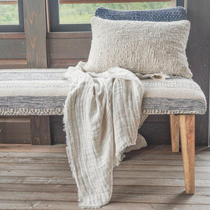 Front view of Handwoven Indigo Striped Ottoman Bench in a farm house.
