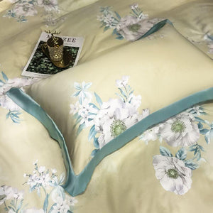 Green pillow covers with flowers prints.