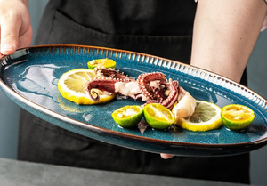 Grilled octopus with limes on Astrild Fish And Fruits Oval Dish.