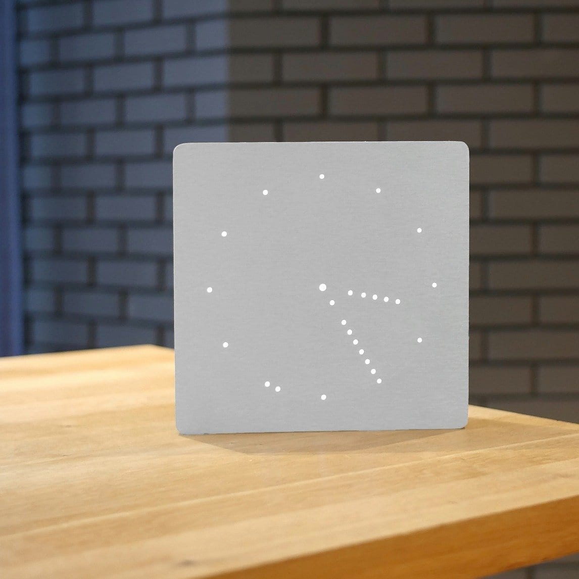 Gray digital analogue clock.