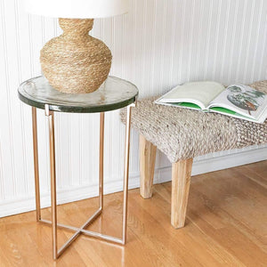 Luxe Glass Side Table With Rose Gold Metal Leg besides of Taupe Handwoven Bench With Wood Legs. 