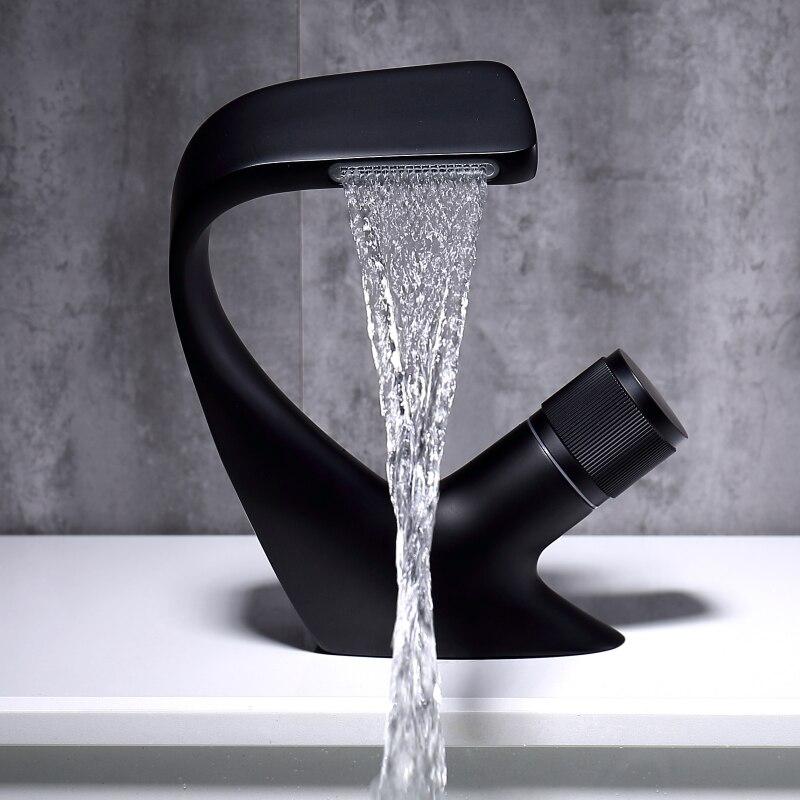 Angel Falls Single Rounded Handle Matte Black Bathroom Faucet with soft water waves flow with brass color rounded handle.
