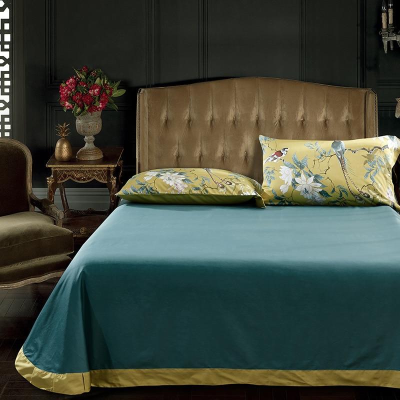 birds of afrodita green sheets with two yellow pillow covers made of egyptian cotton and animal prints.
