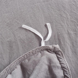 White laces of light gray duvet cover set.