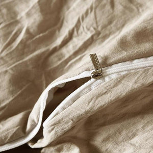White zipper in a cream duvet.