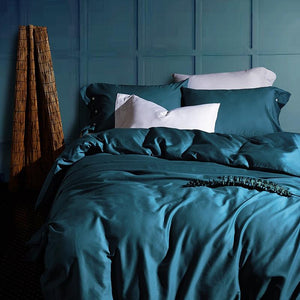 Crystal Blue Venetia egyptian cotton duvet cover set with two blue pillow covers and two white pillow covers.