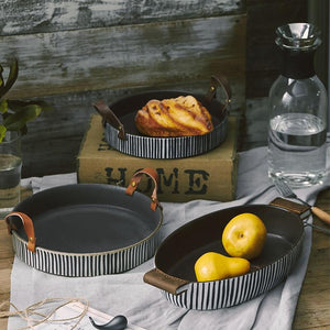 Bread and Pears being displayed with the Exclusive Striped Ceramic Plates with Leather Handles.