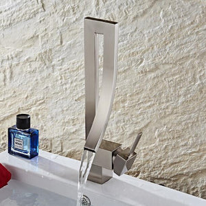 Nickel Martina Bath Tap open on a white sink with light background.