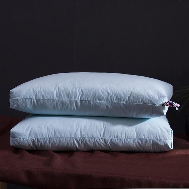 Goose down filling demonstration in a white Giovanni pillow.