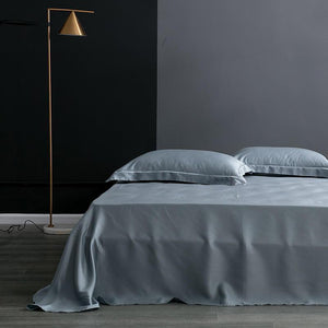 Flat bed sheets in steel color.