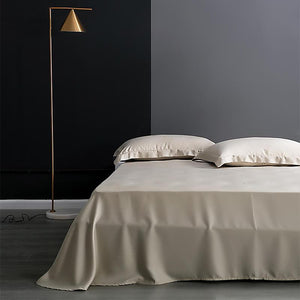 Flat bed sheets in cream color.