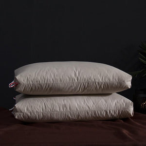 Giovanni Goose Down Pillows in sand color.