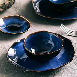 Glazed blue bowls and plates.