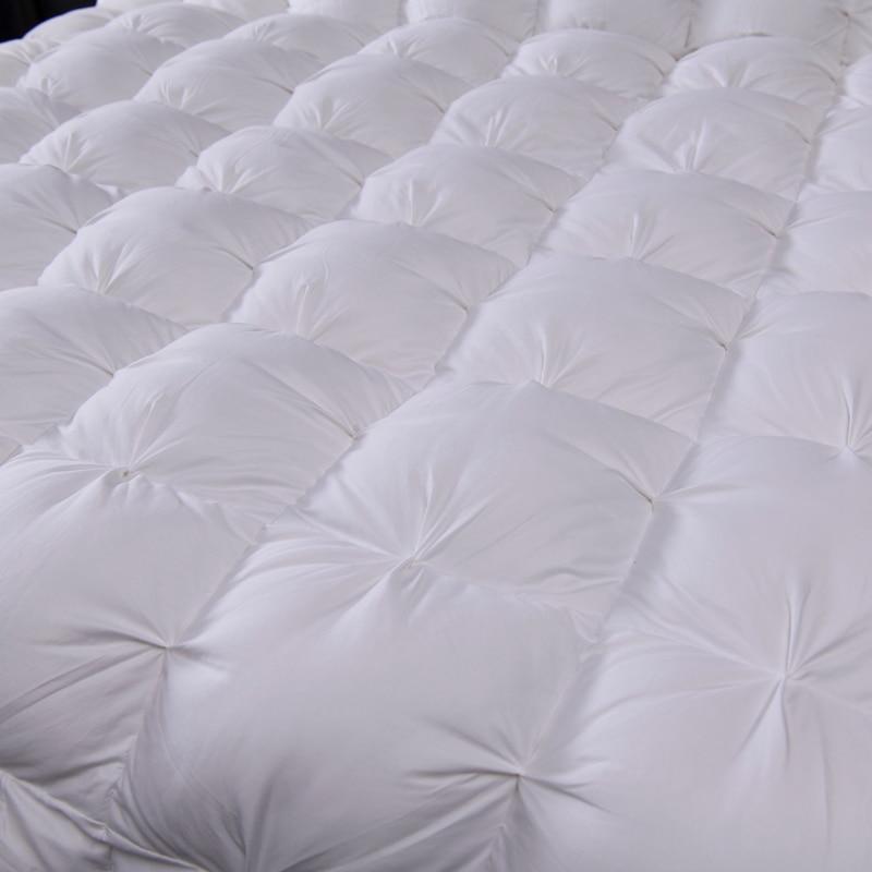 Giuseppina 1000 Thread Count Goose Down White Comforter Bedding Set in a Modern Bedroom available in Queen And King size.