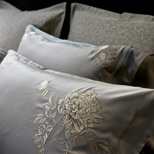 Pillow cover in silver color; it does not include filling.