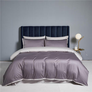 Ava Reversible Duvet Cover Set made of Egyptian Cotton in Purple and Pearl color.