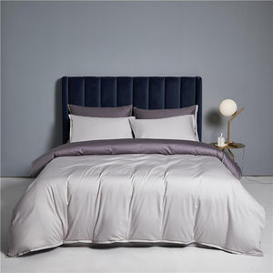 Opposite Side Demonstration of Ava Reversible Duvet Cover Set made of Egyptian Cotton in Purple and Pearl color.